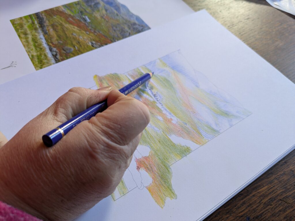 Carleen working on a landscape drawing